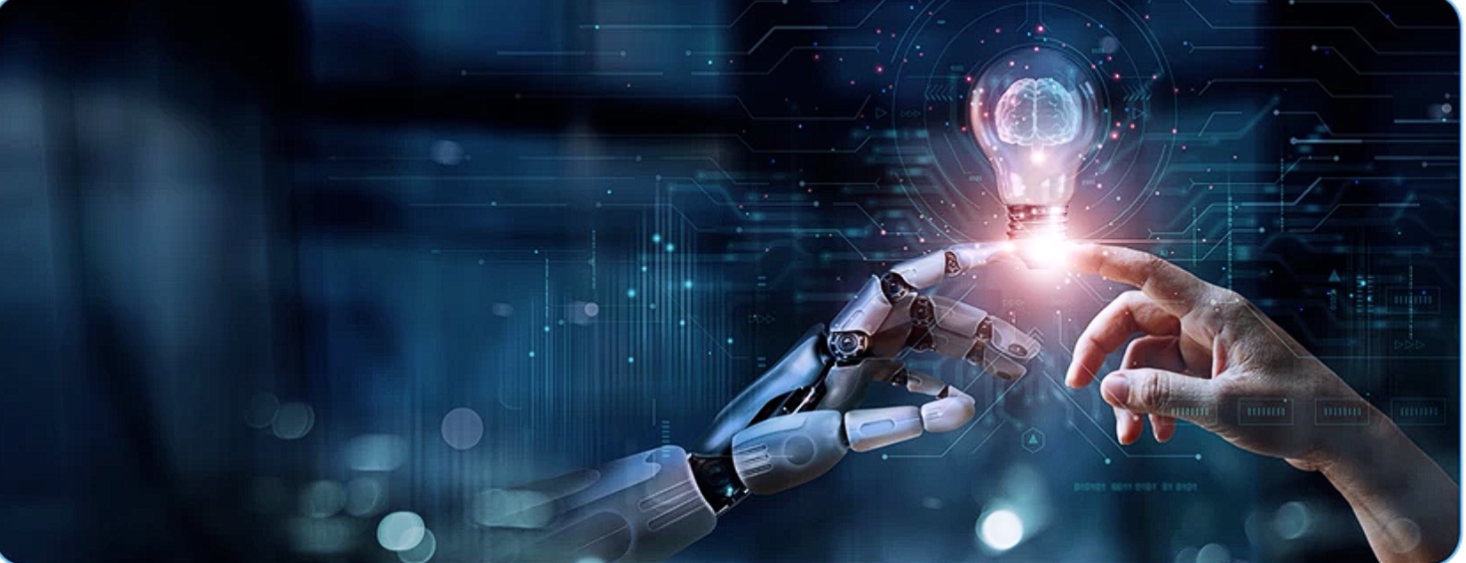 Human and robotic hands meeting around an illuminated AI idea